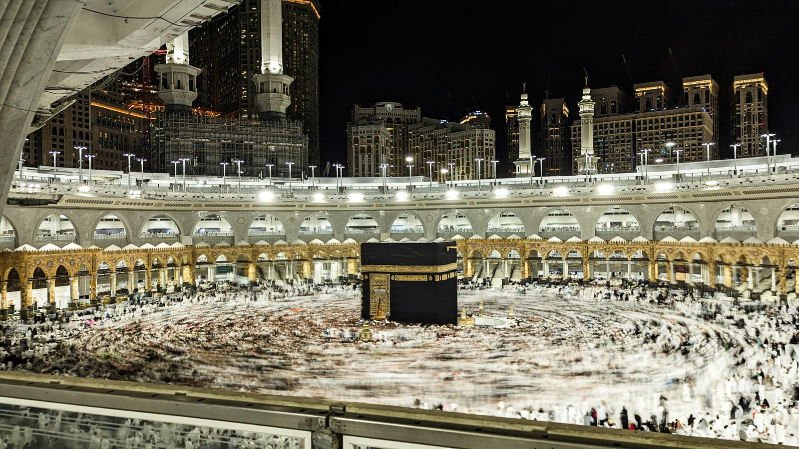 Captivating night view of worshippers circling the Kaaba at Masjid al-Haram, Mecca.